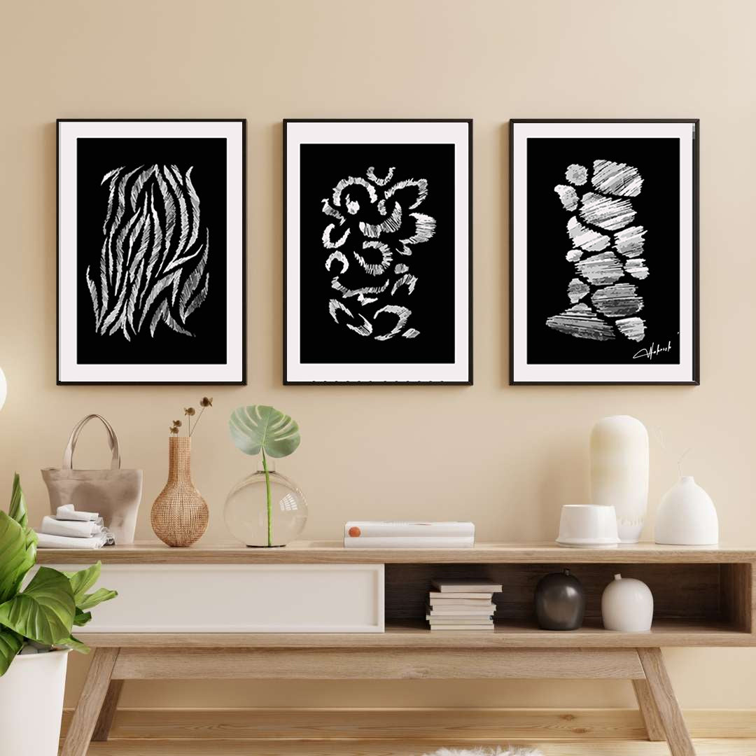 Minimalist black and white wall art set featuring hand-drawn abstract textures in a modern living room setup.